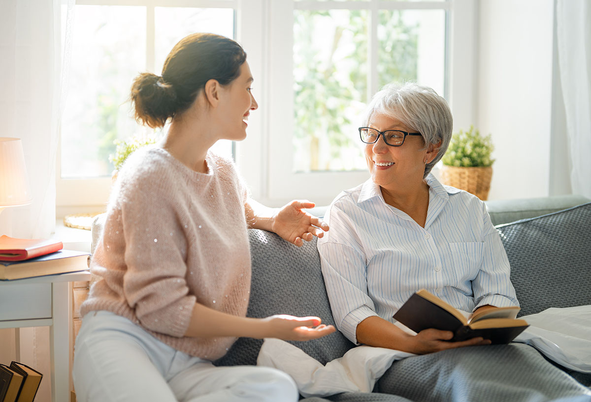 Eucharistic Visitor visiting a home bound member of the church