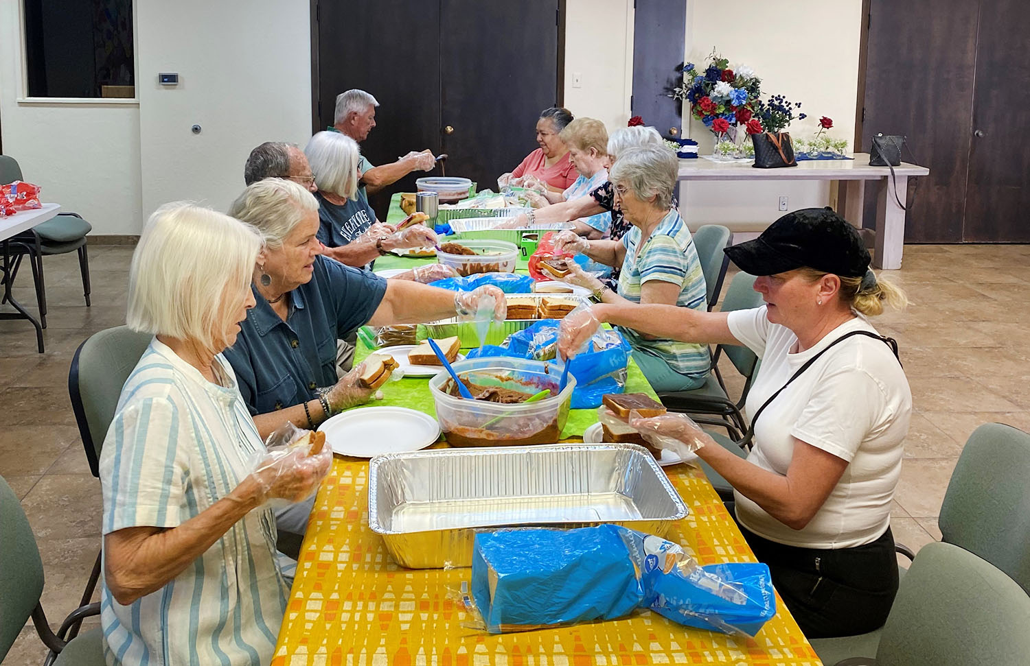Group assembling meals for the homeless at Good Shepherd